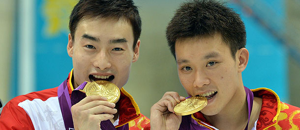 Chinos ganan oro en clavados sincronizados varonil en trampol&iacute;n de 3m