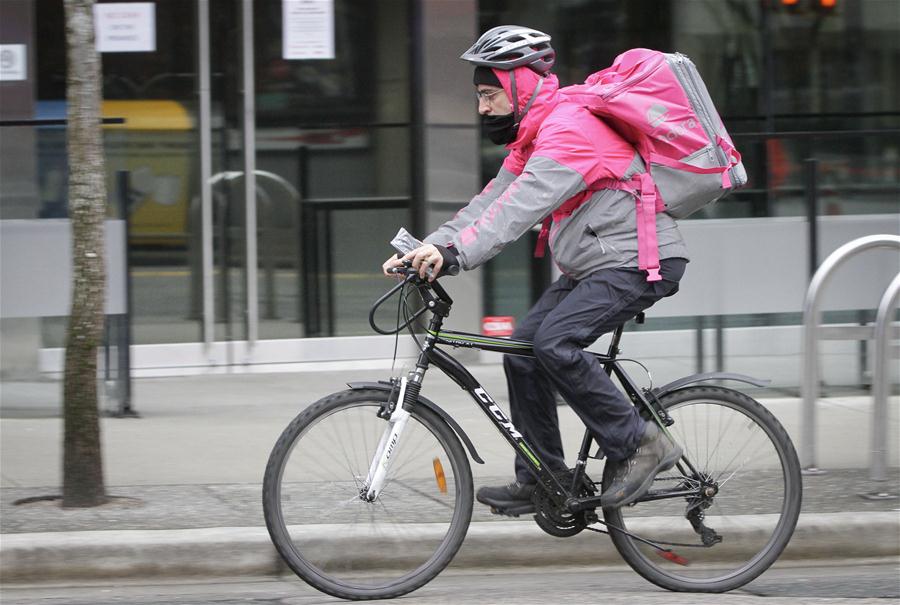 Fotos de repartidores de comida en Vancouver, Canadá
